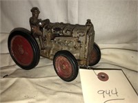 Old cast tractor with driver