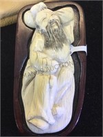 CARVED IVORY MASTADON PIECE WITH LEATHER POUCH