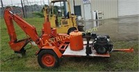 Trailer mounted self-contained backhoe