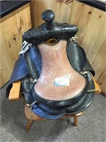 Western leather saddle with stirrups