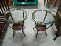 Two round glass top end tables