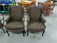 Two brown arm chairs