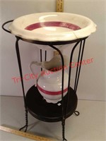 Wrought iron basin stand with wash pitcher and