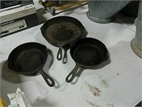 Lot of three cast iron skillets