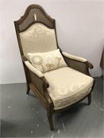 Upholstered and caned armchair