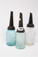 Master Oil spouts with glass jars.