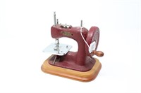 Child's antique sewing machine.7x7