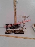 4 decorative purses and display rack