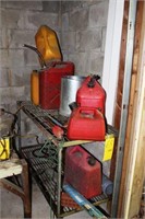 metal rack and 5 gas cans and sprayer