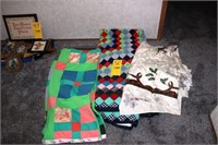 two quilts and tablecloth