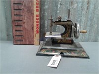 Casige tin hand-crank toy sewing machine