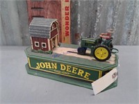 John Deere cast iron bank, 5" by 10"