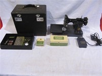 Feather Weight Singer sewing machine & attachments