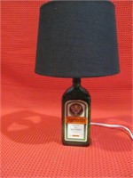 Lamp, green bottle base, black shade
