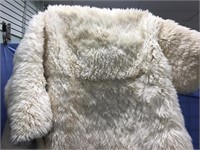 Large genuine lamb skin rug in good condition. Abo
