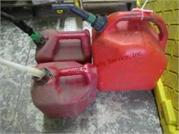 3 plastic gas cans, 5 gal & 2- 2 gal