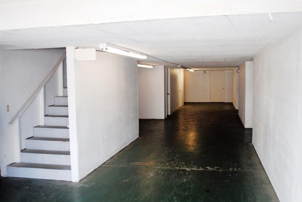 Downstairs to 2-level storage units. (Elevator for upstairs units)