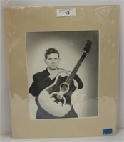 AUTOGRAPHED MATTED PHOTO