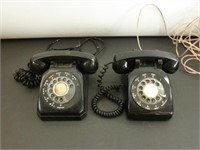 2 black vintage rotary phones