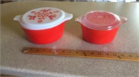 2 red Pyrex dishes