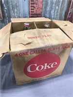 Coke syrup jugs in Coke box