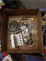 Box of jewelry and knives