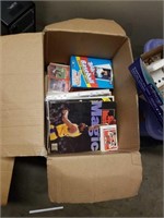 Box of sports cards magazines and newspapers