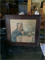 Framed print of old man at desk