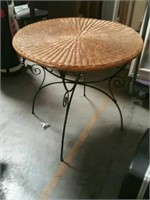 Round wicker table with wrought iron base
