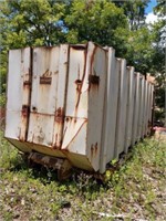 Large enclosed metal roll off container currently