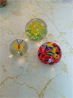 Three hand blown art glass paperweights