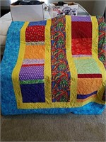 A beautiful handmade quilt with multi colors,