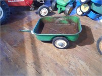Green pedal tractor wagon