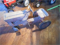 Red pedal tractor