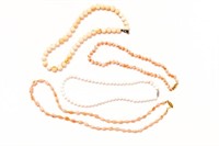 Four assorted natural coral necklaces