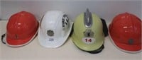 Four various world Fire Service helmets