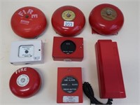 Seven red metal fire and emergency bells