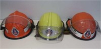 Three NSW Fire Brigade helmets