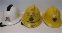 Dorset and Strathclyde Fire helmets with one