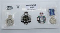 Five Queensland Police hat badges