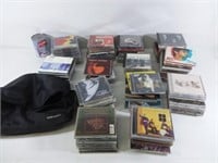 +- 120 CD de musique + 1 sac Case Logic