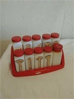 Vintage ceramic spice jars on rack