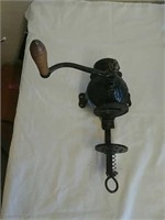 Antique cast iron coffee grinder with wood handle