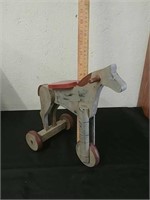 Vintage wooden three-wheeled toy horse