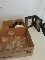 Group of drinking glasses plates and picture