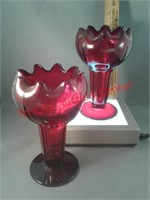 2 glass vases with bulbous tops and tapered stem