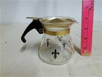 Vintage Pyrex creamer pot with metal