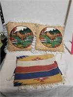 Navajo throw rug with two Wildlife throw pillows