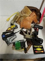 Sierra tool belt with various staple guns,