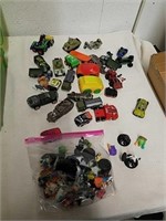 Group of toy cars and DC gaming toys and more